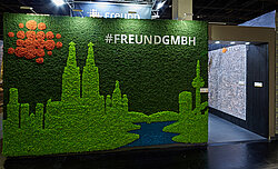 Cologne branding for imm cologne, Freund exhibition stand, Evergreen Premium moss in three colours, skyline, Köln
