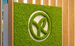 Apple green Evergreen Premium moss wall and moss logo, Yves Rocher office reception