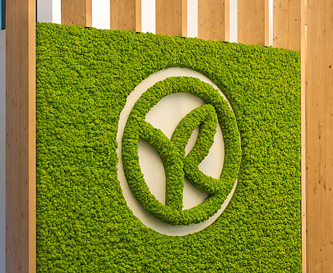 Apple green Evergreen Premium moss wall and moss logo, Yves Rocher office reception