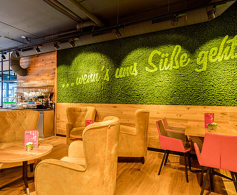 Brand message in apple green integrated into moss green moss wall, Evergreen Moss Premium, Freund, cafe in Vienna